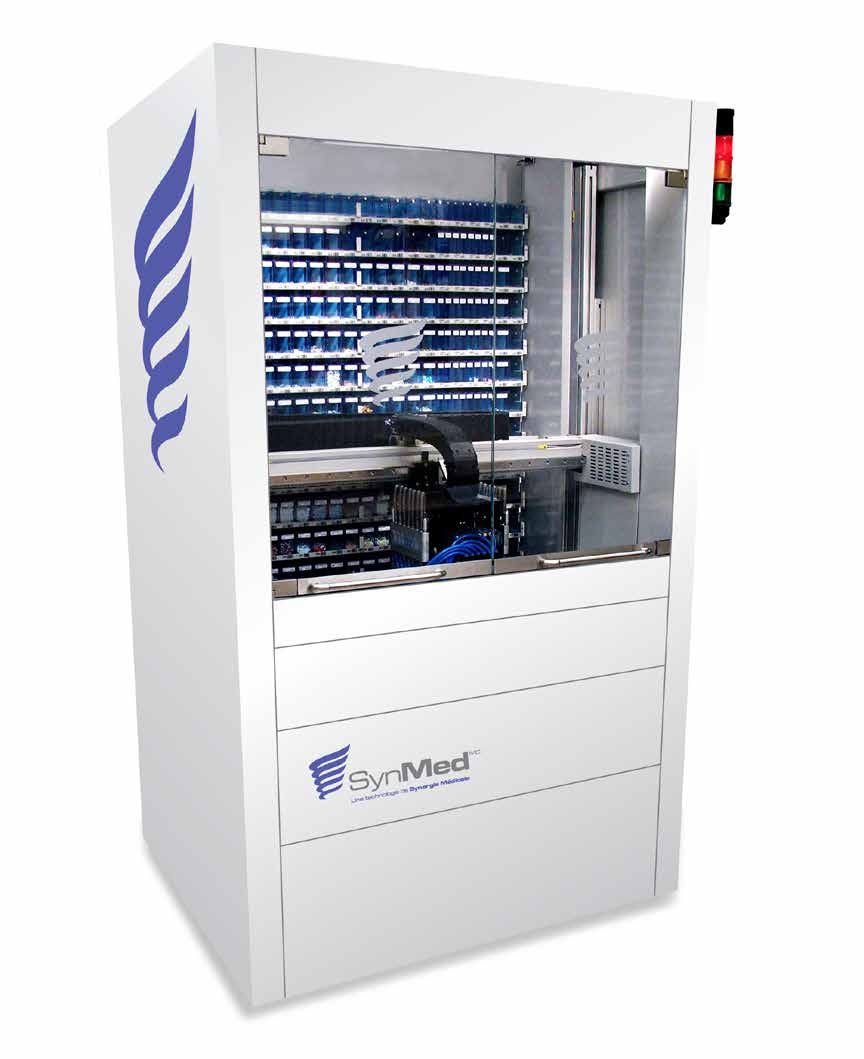 The SynMed XF robotic dispensing system, a tall white cabinet holding rows of medication canisters behind a glass door.